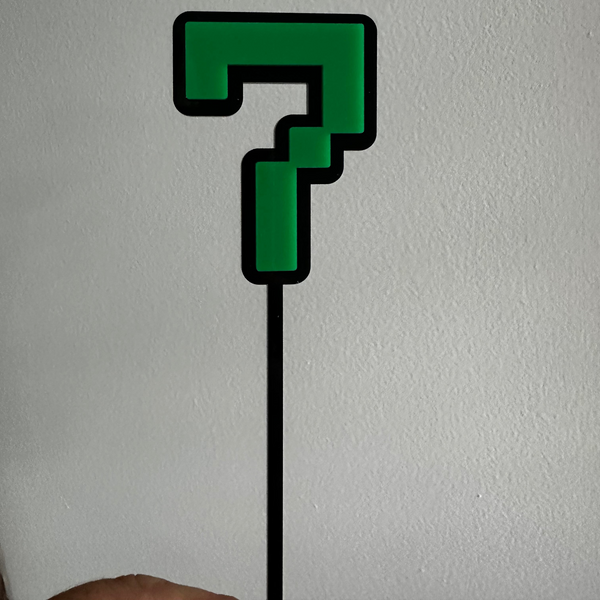 Green Minecraft themed 7 cake topper on a white background