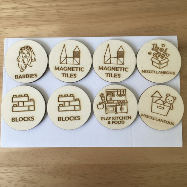 Set of wooden magnetic tiles with various icons and labels on a white background.