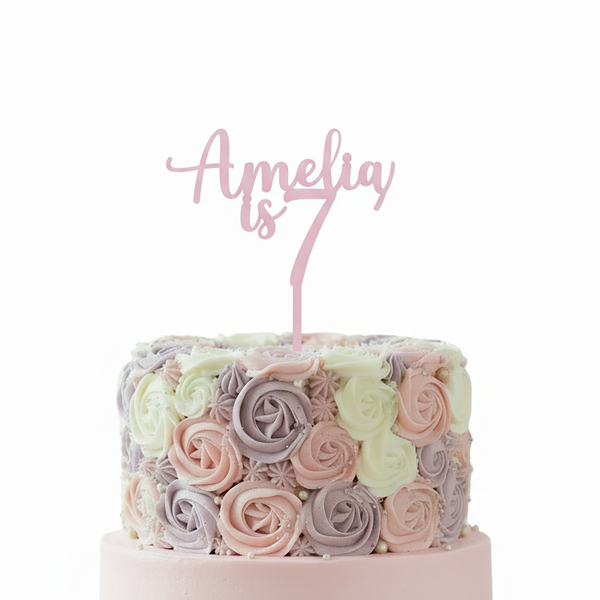 Amelia is 7 – topper on cake, white background