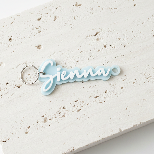 Pale Blue Bag Tag Flat on Travertine