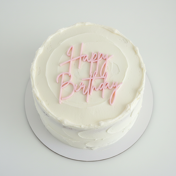 Pink charm flat on white cake – top view