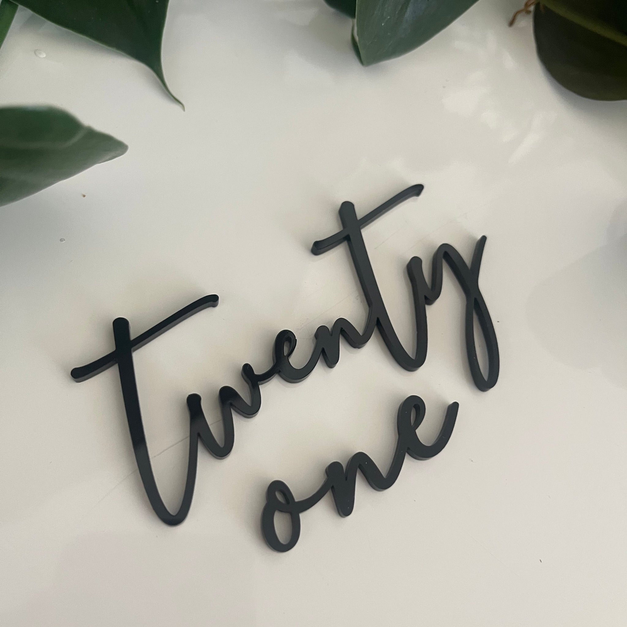 twenty one cake charm in black acrylic